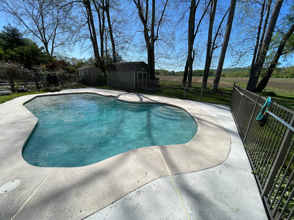 Pool deck using THIN-FINISH™ Decorative Overlay with custom stars to create a unique look by DCE Flooring LLC 20