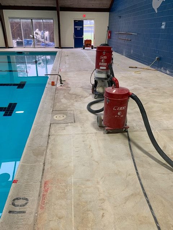 Norfolk, VA indoor pool deck knock down Thin-finish and ccs with stenciled depth markers by Distinguished Designs Decorative Concrete Coatings and Epoxy Floors @ddconcrete.net - 10