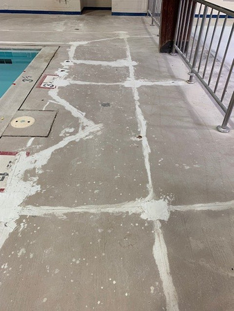 Norfolk, VA indoor pool deck knock down Thin-finish and ccs with stenciled depth markers by Distinguished Designs Decorative Concrete Coatings and Epoxy Floors @ddconcrete.net - 13