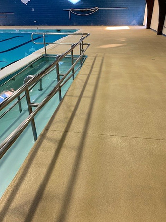 Norfolk, VA indoor pool deck knock down Thin-finish and ccs with stenciled depth markers by Distinguished Designs Decorative Concrete Coatings and Epoxy Floors @ddconcrete.net - 5