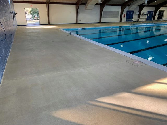 Norfolk, VA indoor pool deck knock down Thin-finish and ccs with stenciled depth markers by Distinguished Designs Decorative Concrete Coatings and Epoxy Floors @ddconcrete.net - 6