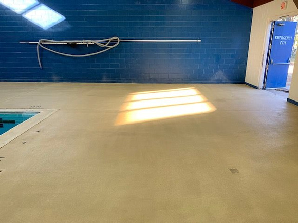 Norfolk, VA indoor pool deck knock down Thin-finish and ccs with stenciled depth markers by Distinguished Designs Decorative Concrete Coatings and Epoxy Floors @ddconcrete.net - 7