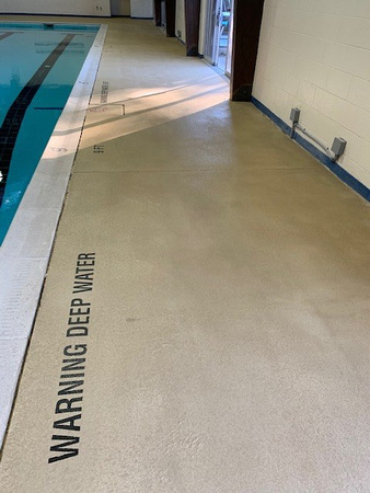 Norfolk, VA indoor pool deck knock down Thin-finish and ccs with stenciled depth markers by Distinguished Designs Decorative Concrete Coatings and Epoxy Floors @ddconcrete.net - 8