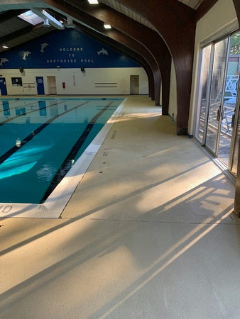 Norfolk, VA indoor pool deck knock down Thin-finish and ccs with stenciled depth markers by Distinguished Designs Decorative Concrete Coatings and Epoxy Floors @ddconcrete.net - 9