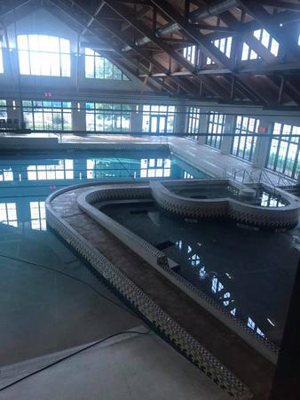 The Lodge Des Peres indoor swimming pool 4k sf of spray texture by Advanced Construction - 1