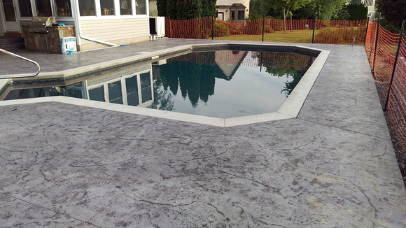 Natural stone pool deck by Hoffman Stamped Concrete LLC - 1