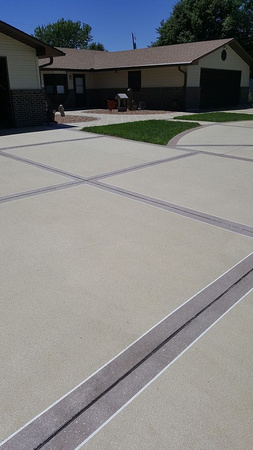 Driveway and sidewalk thin-finish by Nebraska Concrete Coatings @nebraskaconcretecoatings - 3