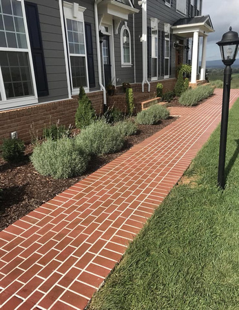 Walkway with brick pattern by Great FAlls Development Company - 2