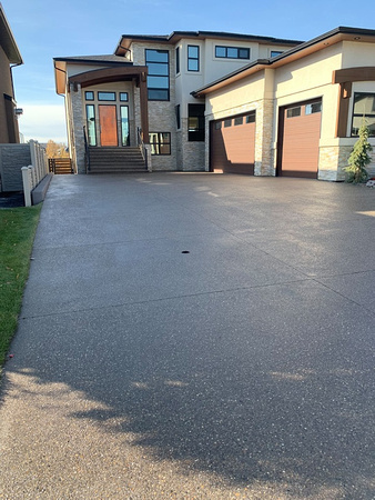 Driveway exposed aggregate with CSS sealer in Red Deer, AB by Rusty Spurr Coatings @rustyspurrcoatings - 2