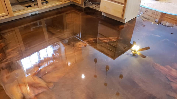 HOP coffee and copper reflector over plywood sub-floor by Advanced Concrete Solutions LLC - 1