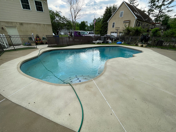 Pool deck using THIN-FINISH™ Decorative Overlay with custom stars to create a unique look by DCE Flooring LLC 5