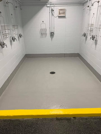 Shower units at Thomas Creek ice arena step by step-1-Grinded of exsisting coatings 2-preceptor 3-Vb5 4-pt4 double broadcast 5-pt4 grout coat 6-Ausv 7-safety yellow by Avella painting inc - 1
