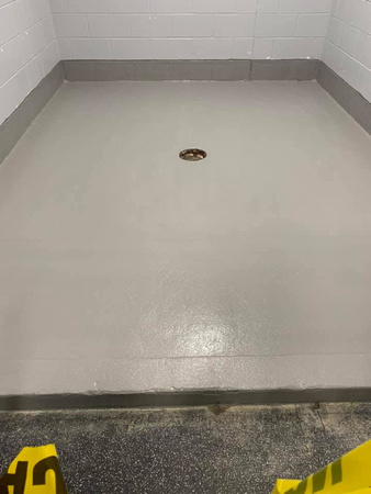 Shower units at Thomas Creek ice arena step by step-1-Grinded of exsisting coatings 2-preceptor 3-Vb5 4-pt4 double broadcast 5-pt4 grout coat 6-Ausv 7-safety yellow by Avella painting inc - 2
