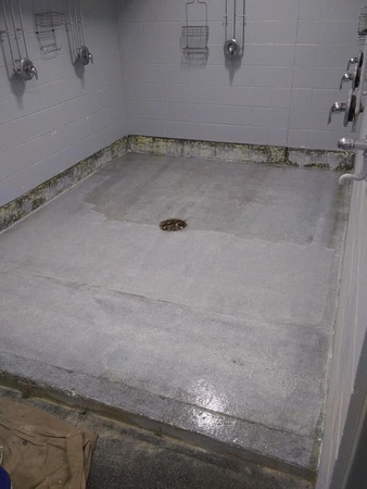Shower units at Thomas Creek ice arena step by step-1-Grinded of exsisting coatings 2-preceptor 3-Vb5 4-pt4 double broadcast 5-pt4 grout coat 6-Ausv 7-safety yellow by Avella painting inc - 3