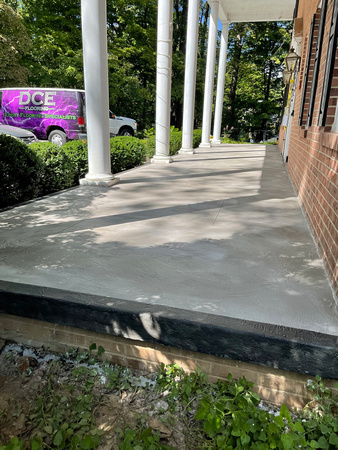 Custom Decorative Concrete Overlay installed around the exterior of this house by DCE Flooring LLC 14