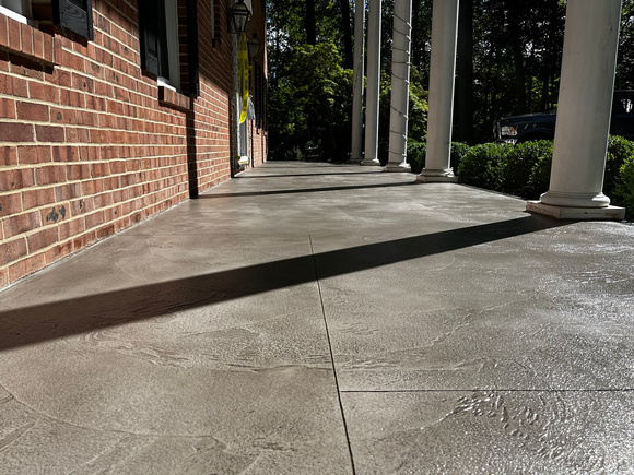 Custom Decorative Concrete Overlay installed around the exterior of this house by DCE Flooring LLC 5