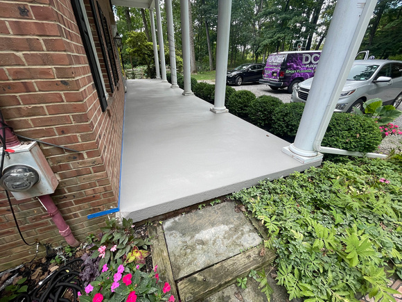 Custom Decorative Concrete Overlay installed around the exterior of this house by DCE Flooring LLC 19