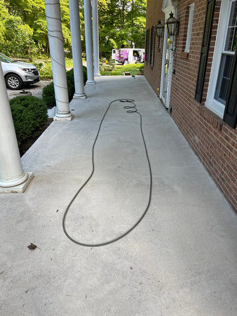 Custom Decorative Concrete Overlay installed around the exterior of this house by DCE Flooring LLC 24